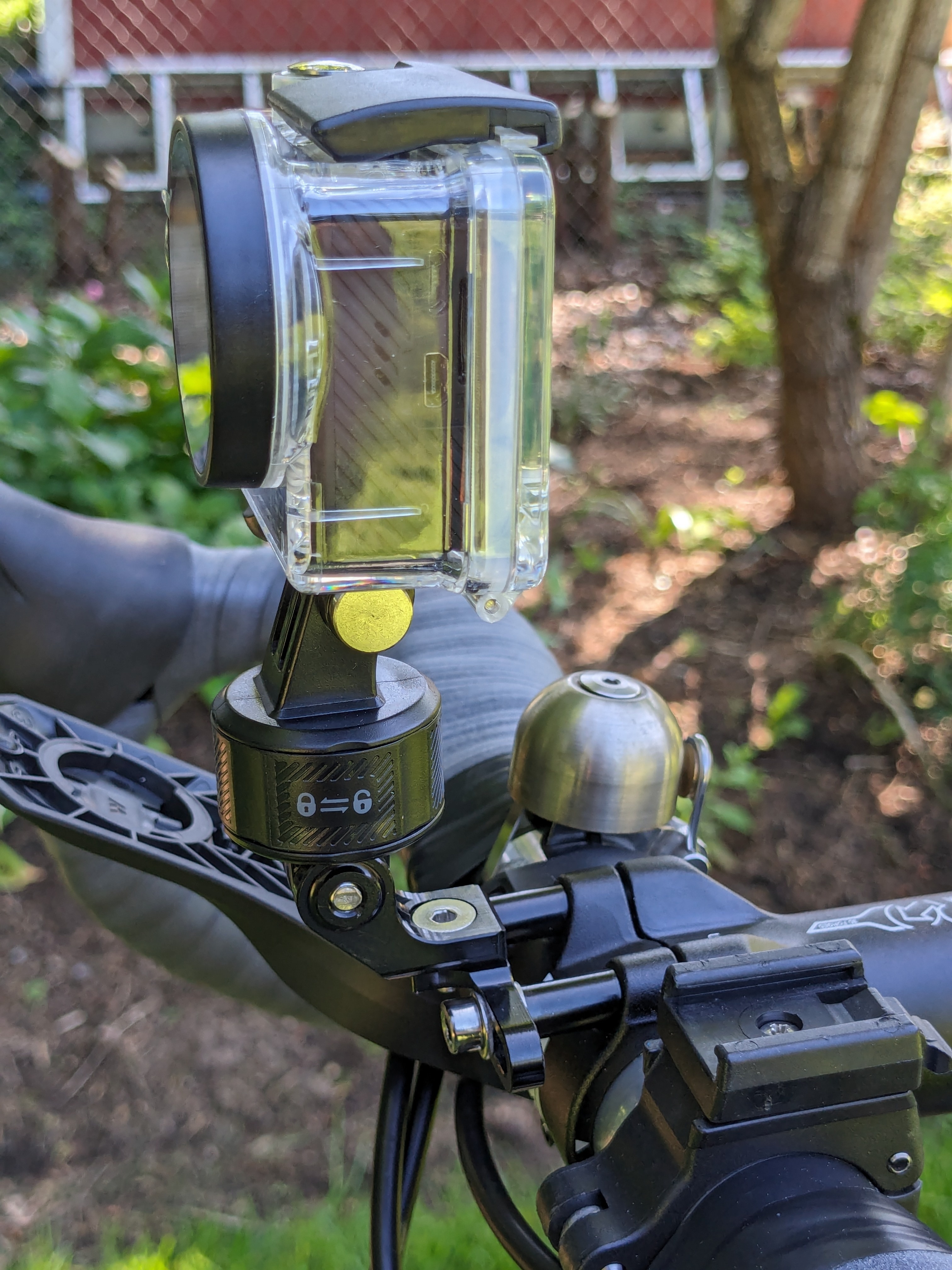 GUB bike camera mount in use with action camera mounted to a bicycle