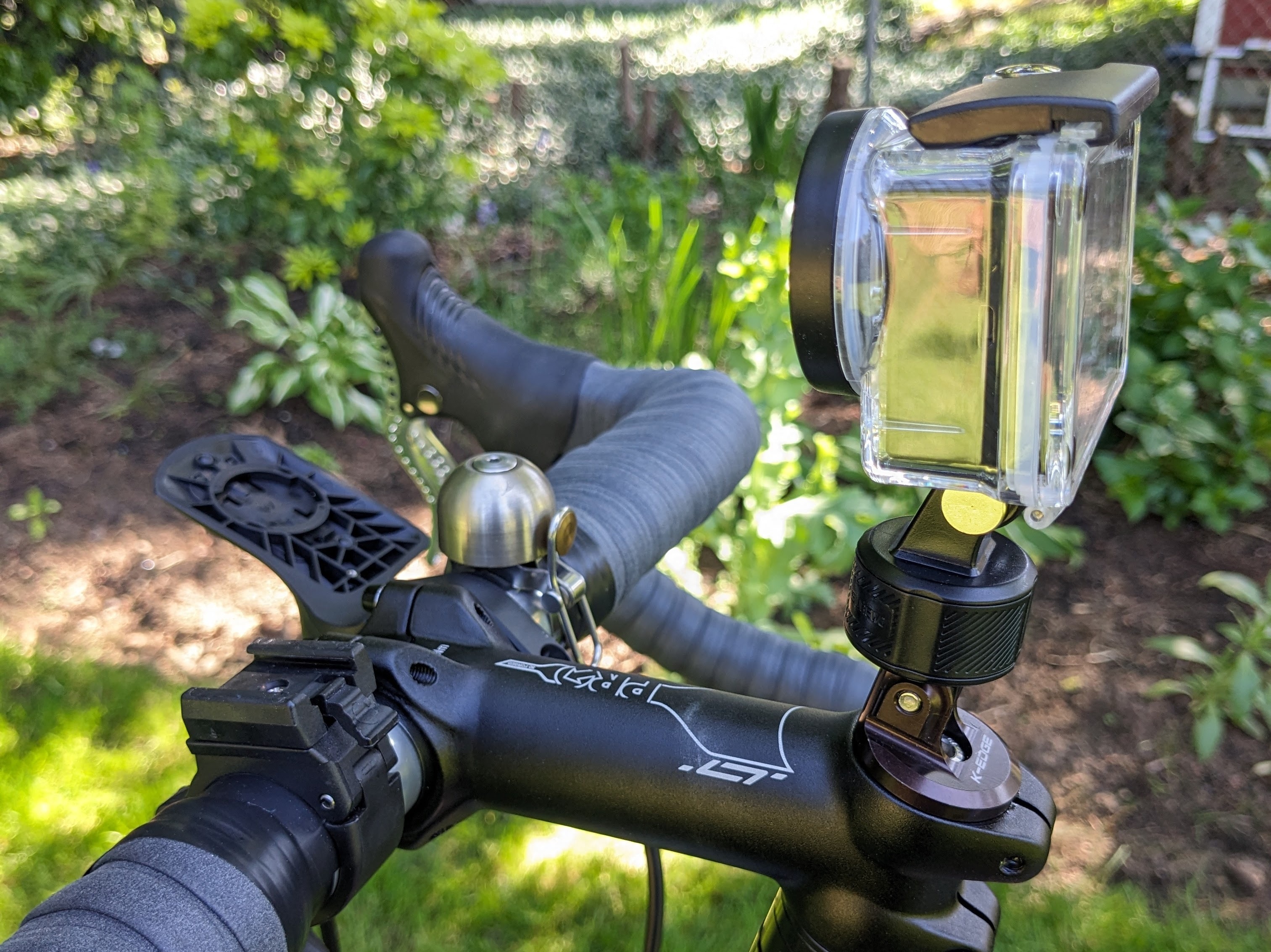 SUREWO magnetic & swivel lock in use with action camera mounted to a bicycle